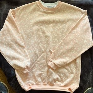 Sweatshirt by Fleece Forward in pale pink with a white embellished vine pattern